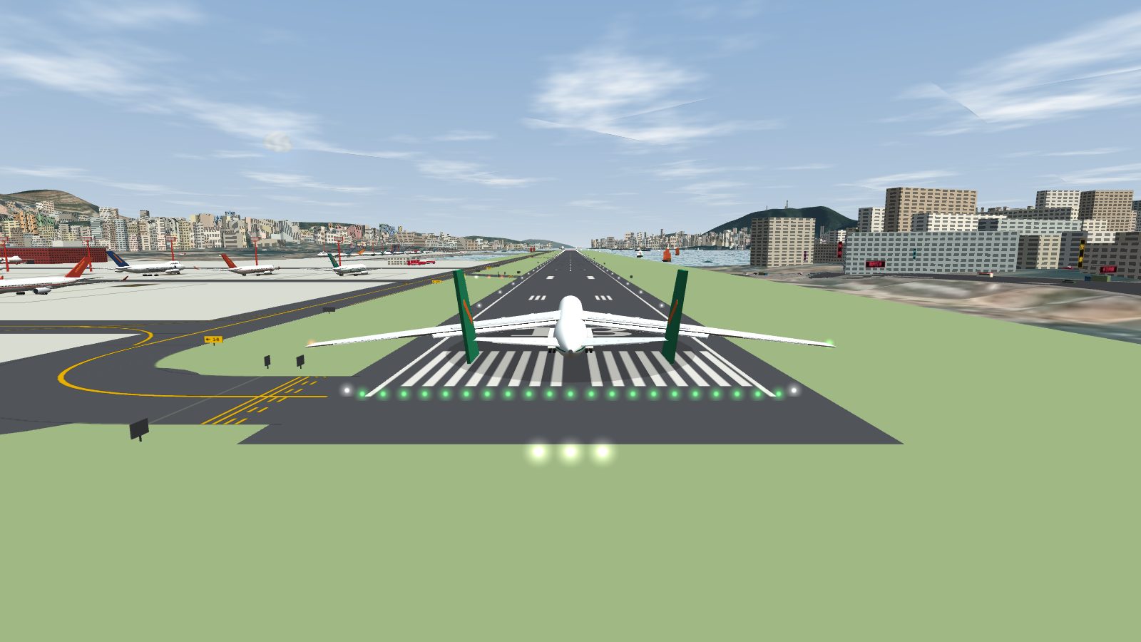 The An-225 from behind on the runway threshold, with its wings stretching past both edges of the runway and its twin fins upright.