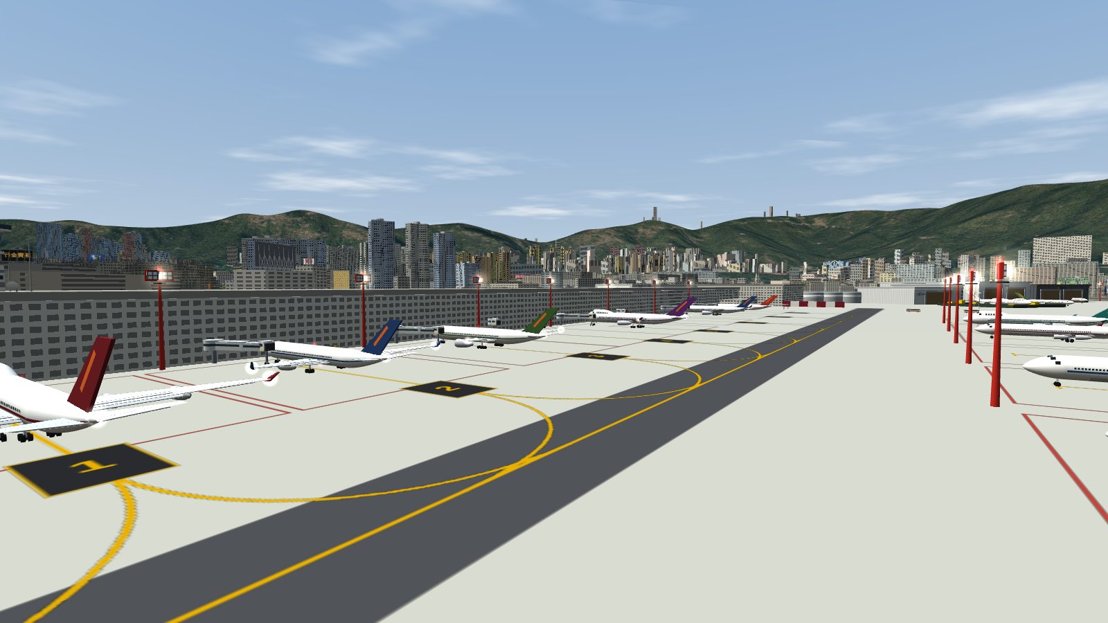 The terminal pier with aircraft at their jet bridges, red floodlight masts along the pier between the stands, and more masts across the apron.