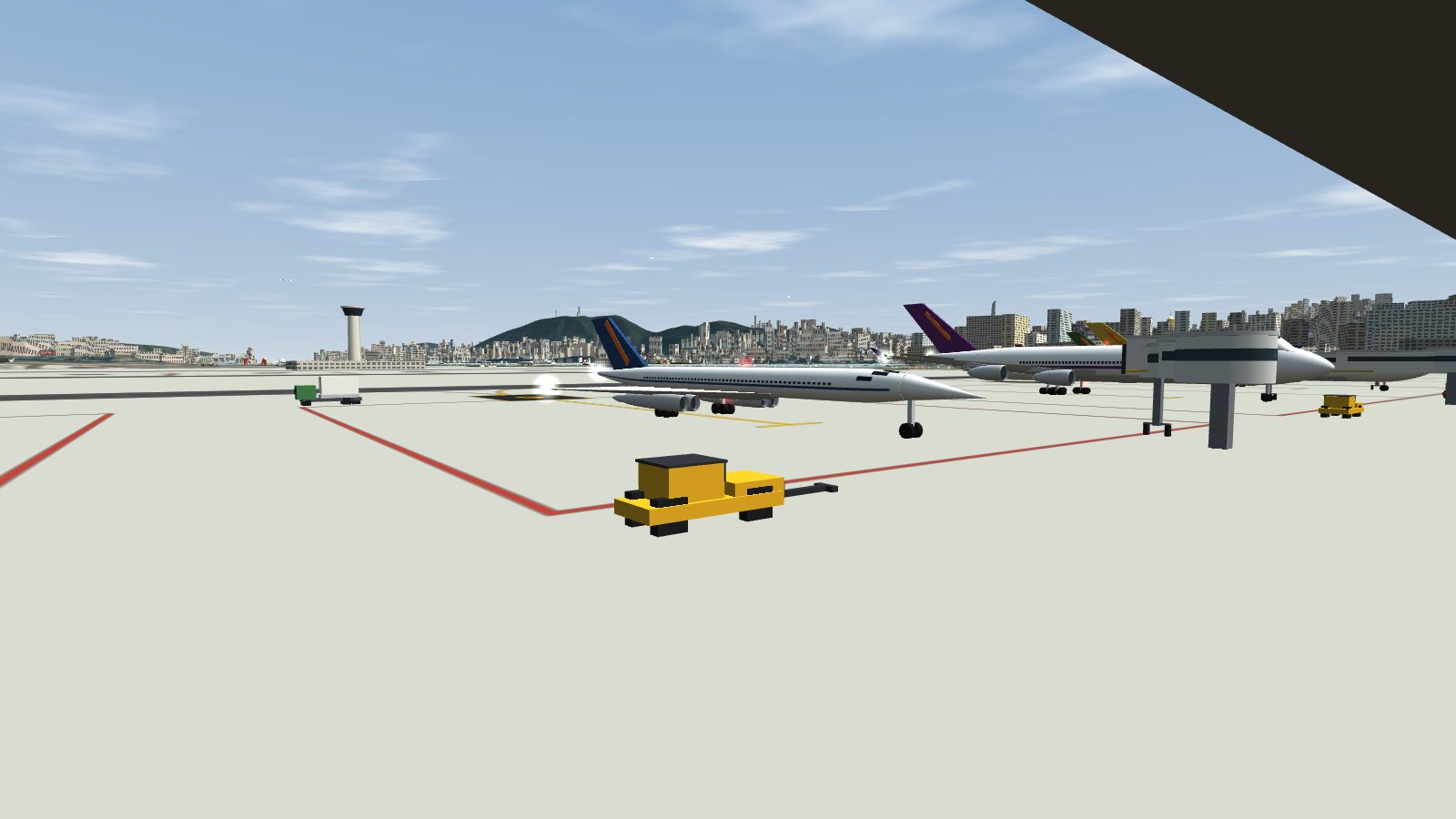 The slim delta-wing jet taxiing on the apron with its nose drooped, next to a wide-body at a jet bridge.
