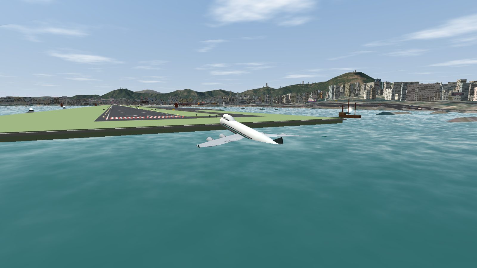 A 747 wreck seen from behind, lying in the harbour at the end of the Kai Tak runway, the tail under water and the runway behind it.