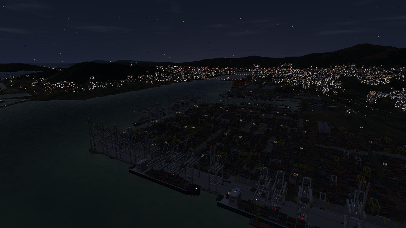 The container terminals at night, lit by high-mast floodlights, with red obstruction lights on the crane booms.