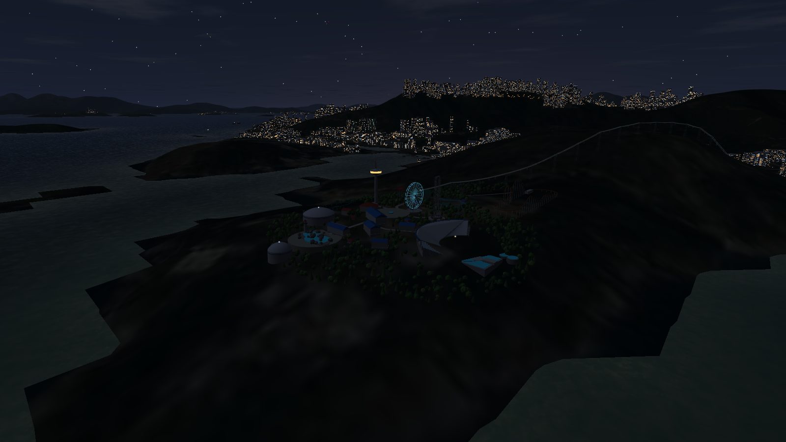 The Ocean Park headland at night: the tower cabin glowing, a cyan-lit Ferris wheel and the dark outline of the theatre.