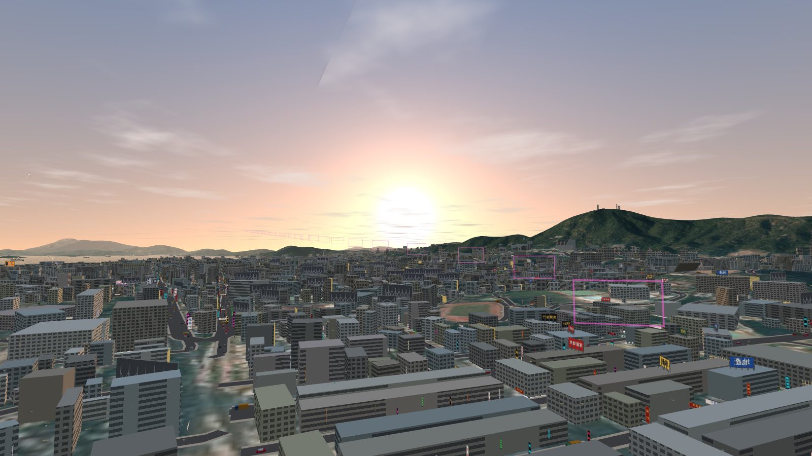 The sun low over the hills west of Kowloon with a pale orange sky.